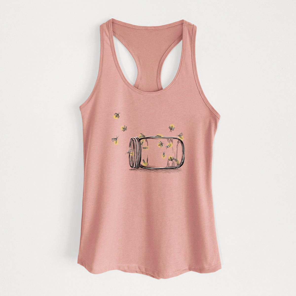 Desert pink women's racerback tank top laid flat, printed with a mason jar with glowing yellow fireflies flying out of it.