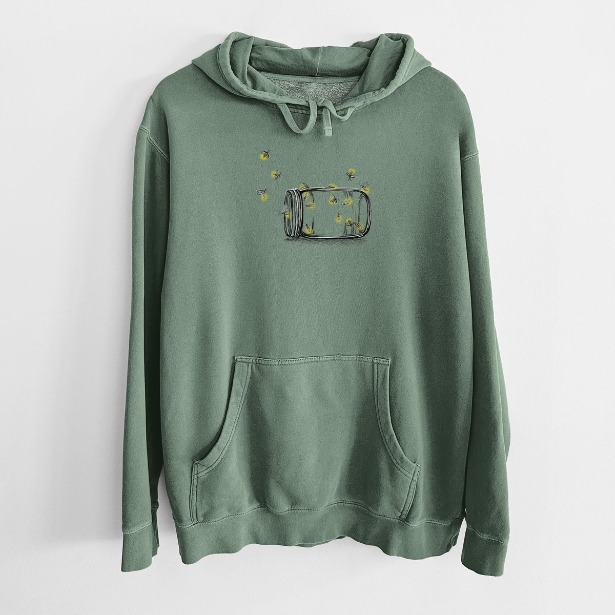 Alpine green pigment dyed hoodie laid flat, printed with a mason jar with glowing yellow fireflies flying out of it.