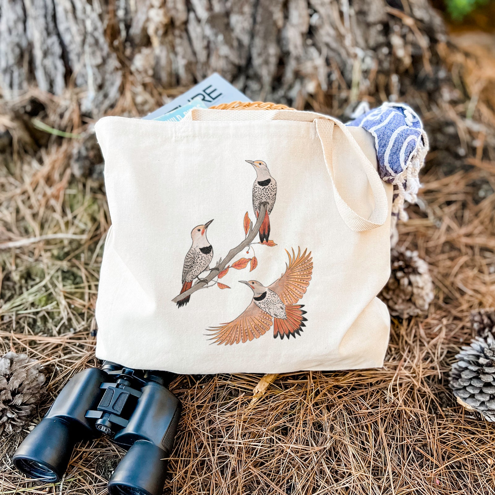 Natural canvas tote bag printed with a full-color illustration of three northern flickers on a branch, one in flight.