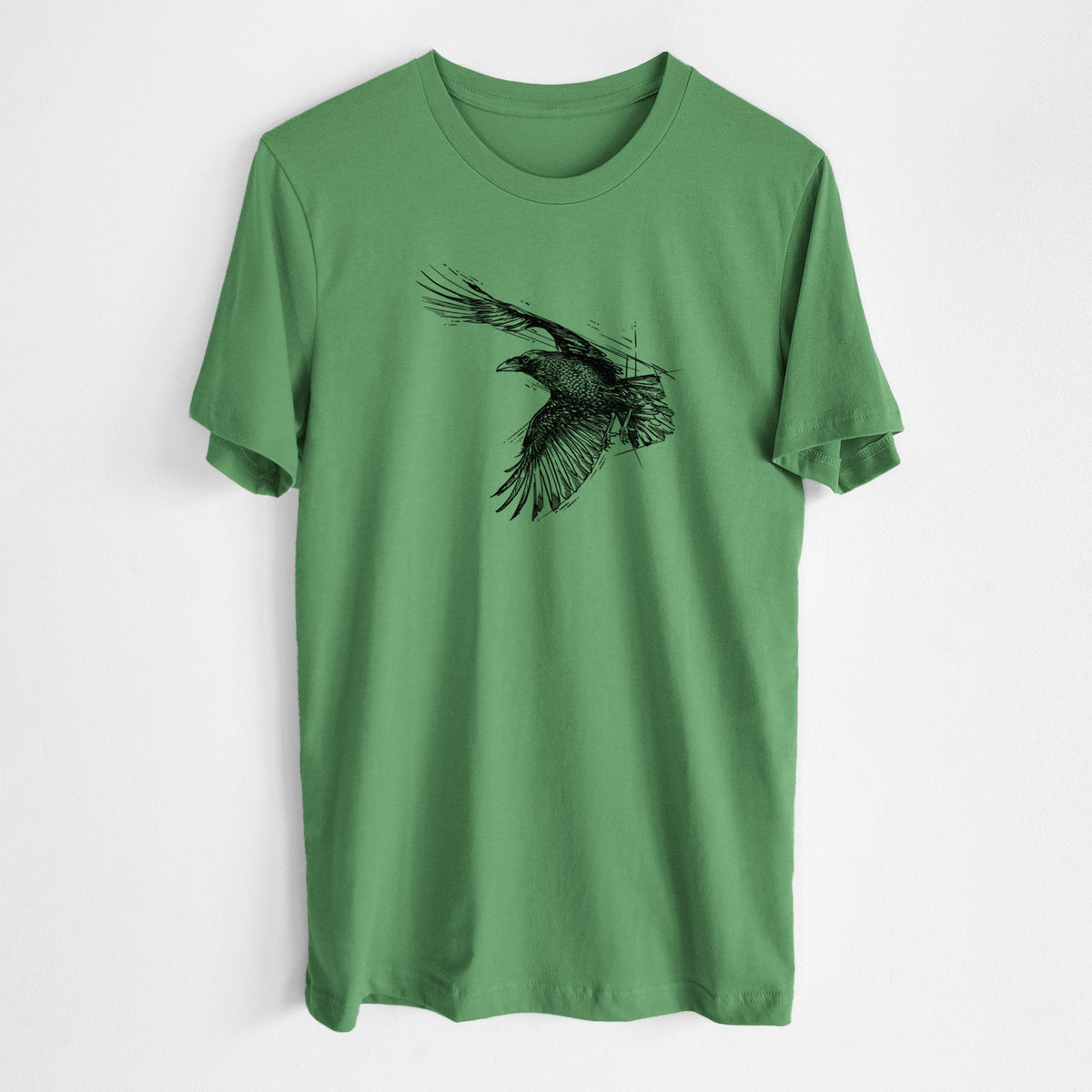 Leaf green lightweight cotton t-shirt laid flat, printed with a black ink illustration of a raven in flight with its wings spread.