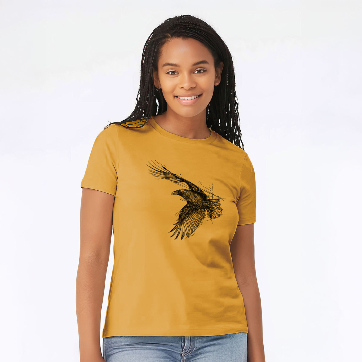 Woman wearing a mustard yellow women's relaxed fit cotton t-shirt printed with a black ink illustration of a raven in flight with its wings spread.
