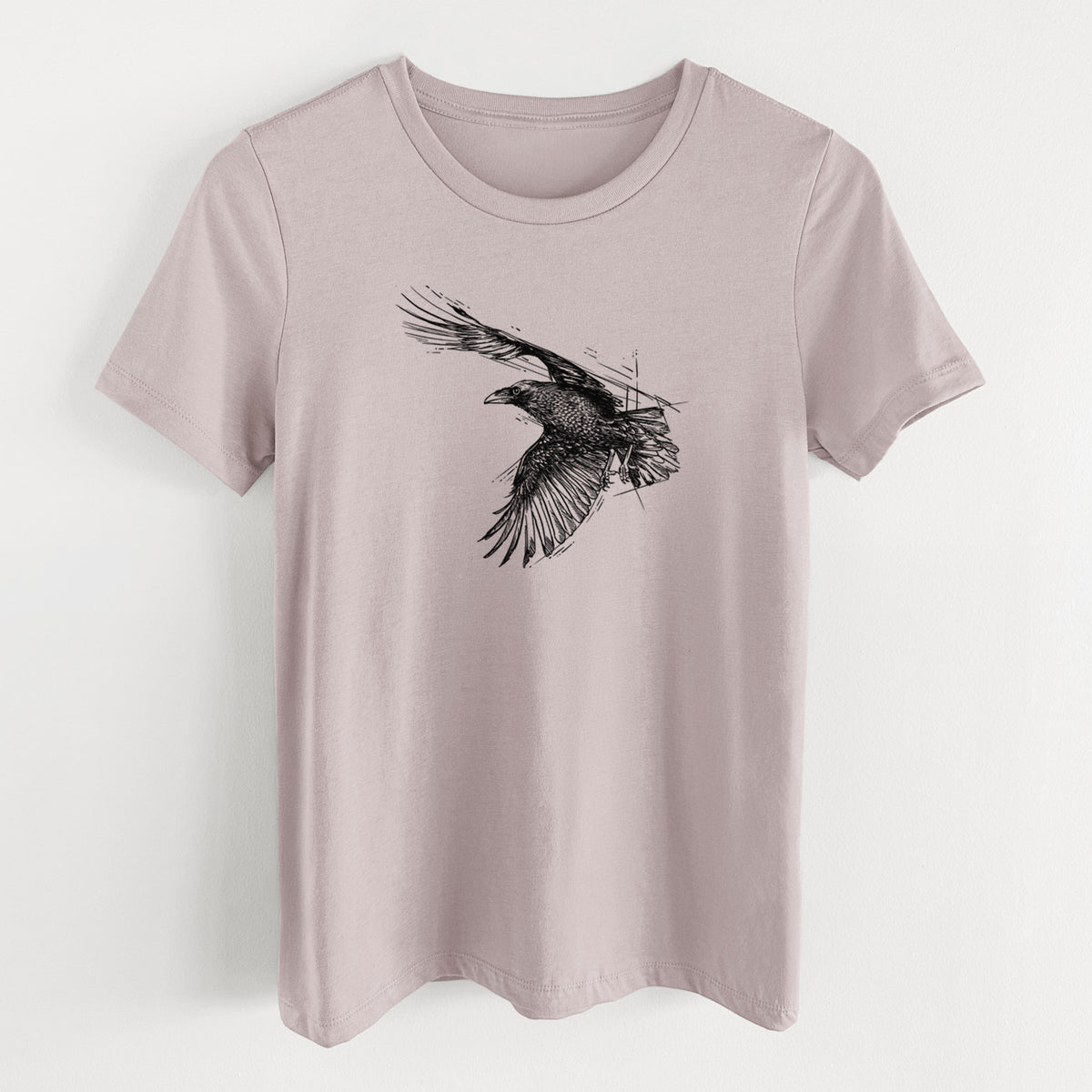 Pink gravel women's relaxed fit cotton t-shirt laid flat, printed with a black ink illustration of a raven in flight with its wings spread.