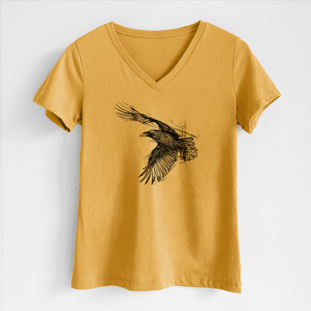 Honeycomb yellow women's relaxed fit cotton V-neck t-shirt laid flat, printed with a black ink illustration of a raven in flight with its wings spread.