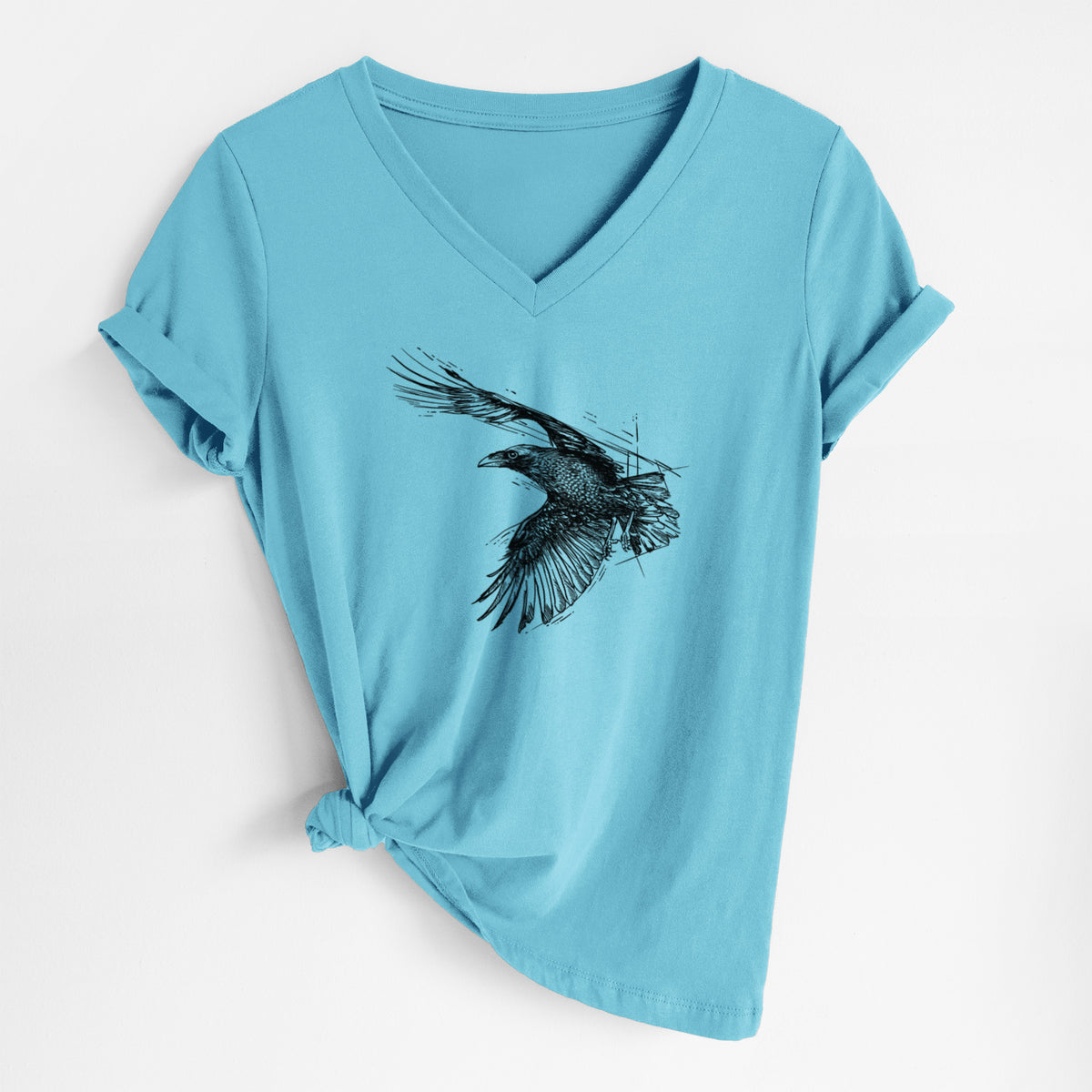 Turquoise women's relaxed fit cotton V-neck t-shirt laid flat, printed with a black ink illustration of a raven in flight with its wings spread.