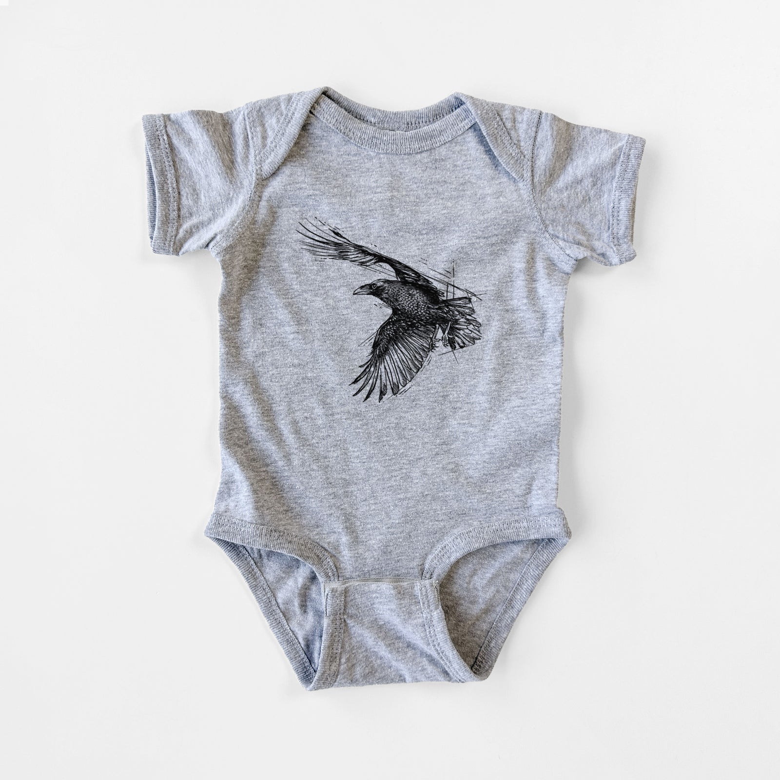 Grey baby bodysuit laid flat, printed with a black ink illustration of a raven in flight with its wings spread.
