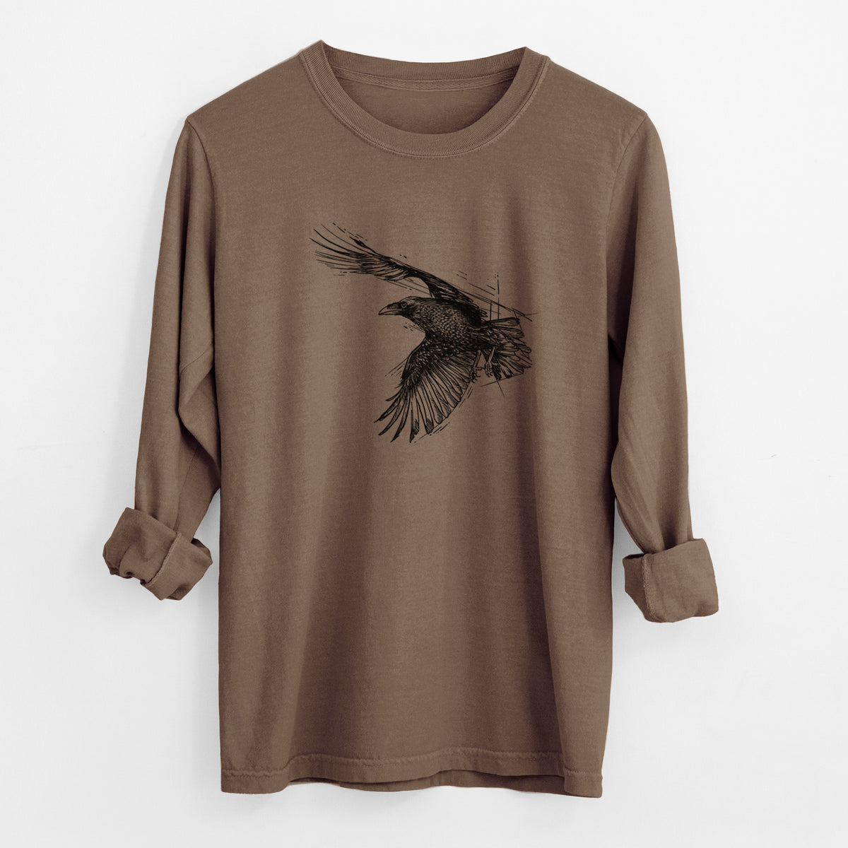 Espresso brown Comfort Colors long sleeve shirt laid flat with the cuffs rolled, printed with a black ink illustration of a raven in flight with its wings spread.