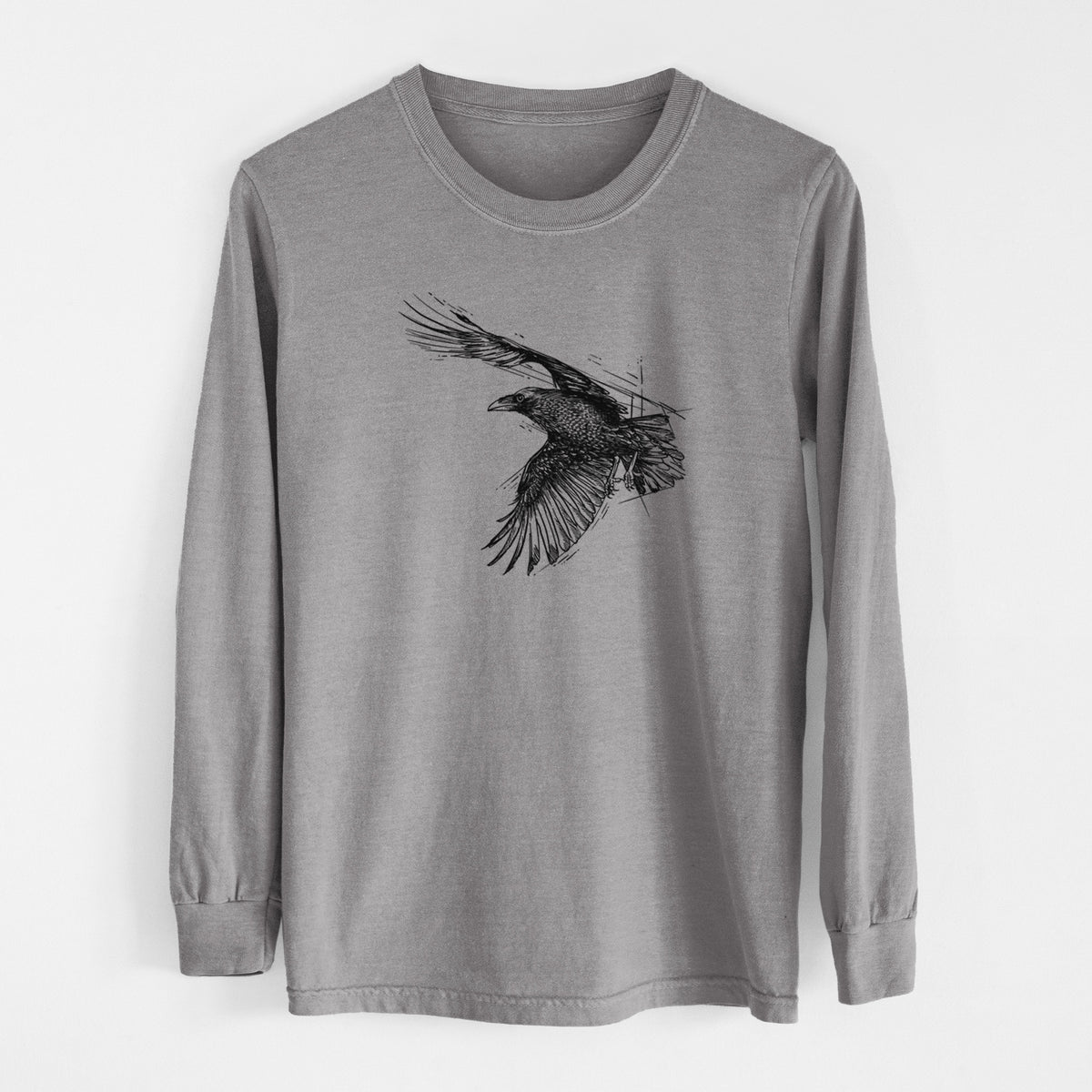 Grey Comfort Colors long sleeve shirt laid flat, printed with a black ink illustration of a raven in flight with its wings spread.