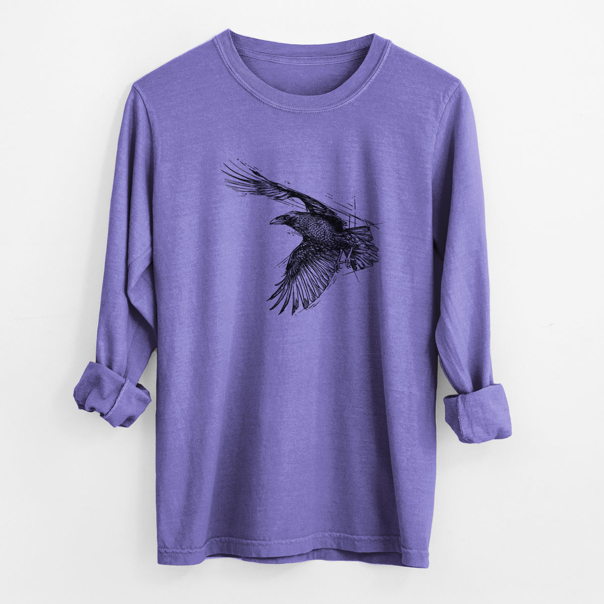 Violet purple Comfort Colors long sleeve shirt laid flat with the cuffs rolled, printed with a black ink illustration of a raven in flight with its wings spread.