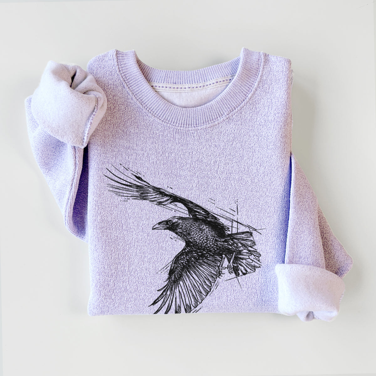 Ice purple knit sweatshirt printed with a black ink illustration of a raven in flight with its wings spread, styled flat.