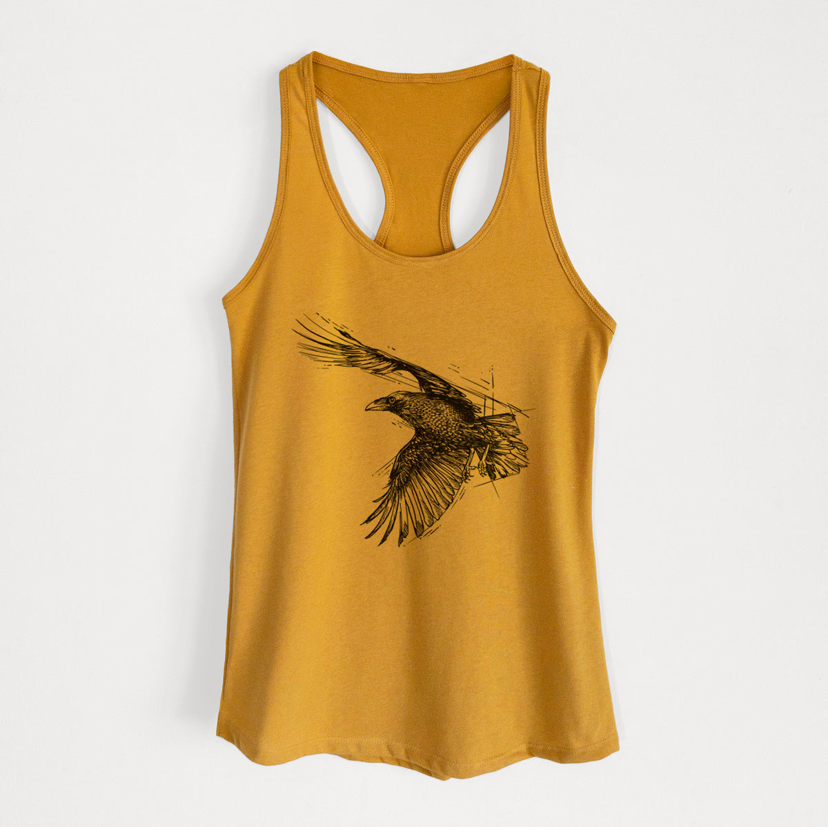 Gold women's racerback tank top laid flat, printed with a black ink illustration of a raven in flight with its wings spread.