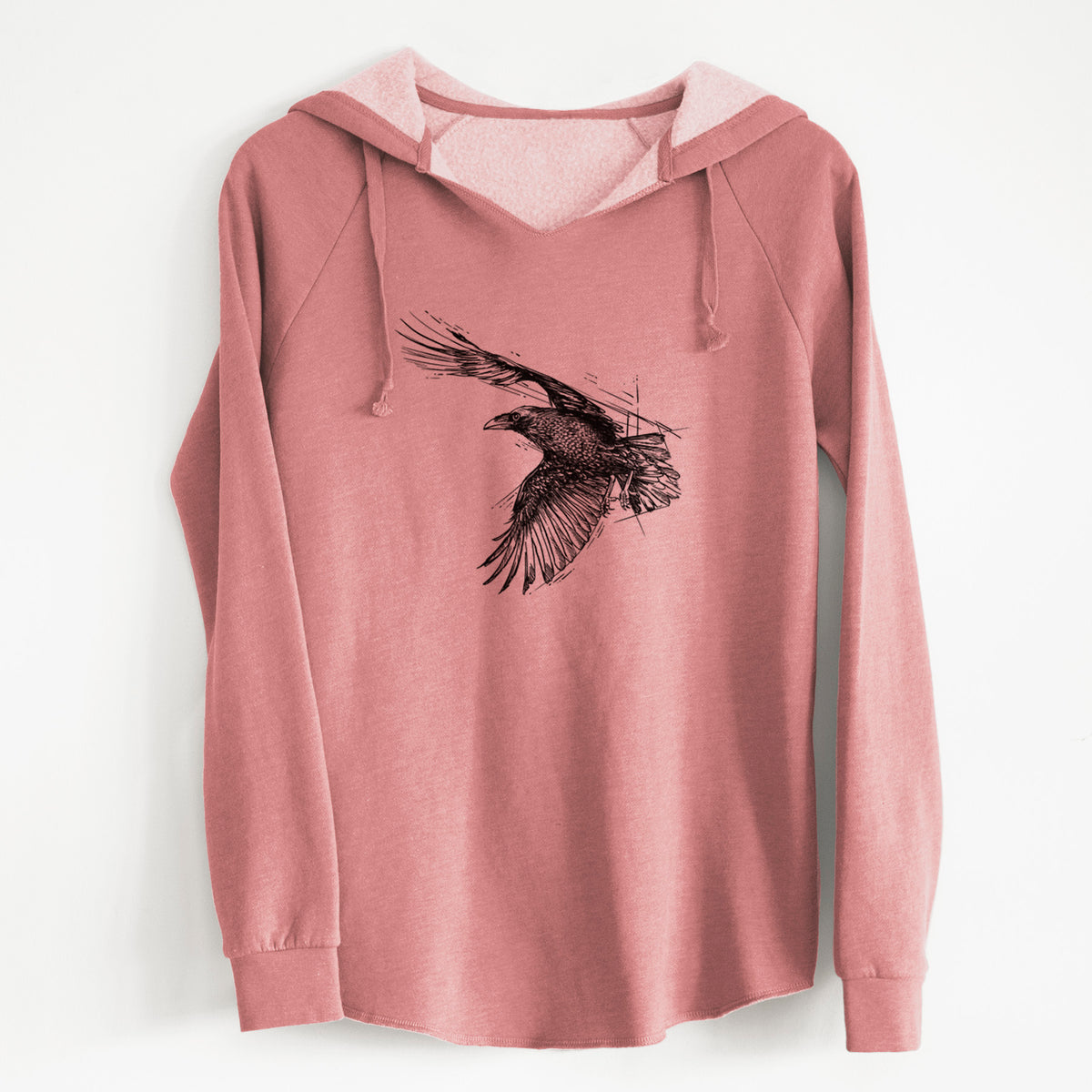 Dusty rose women's Cali Wave hooded sweatshirt laid flat, printed with a black ink illustration of a raven in flight with its wings spread.