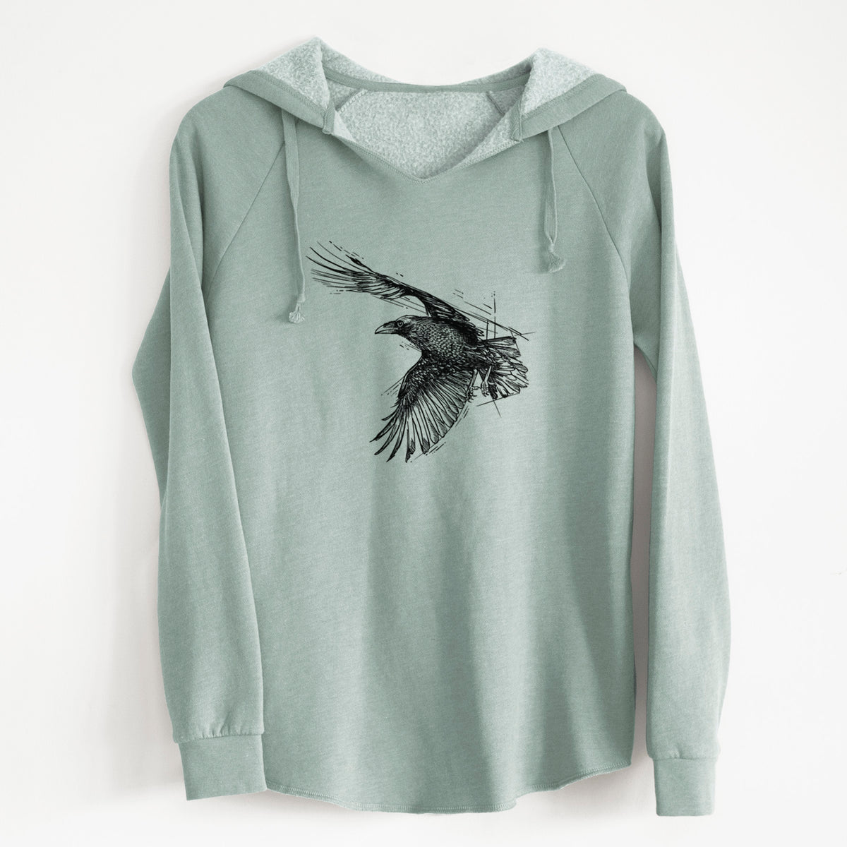 Sage green women's Cali Wave hooded sweatshirt laid flat, printed with a black ink illustration of a raven in flight with its wings spread.