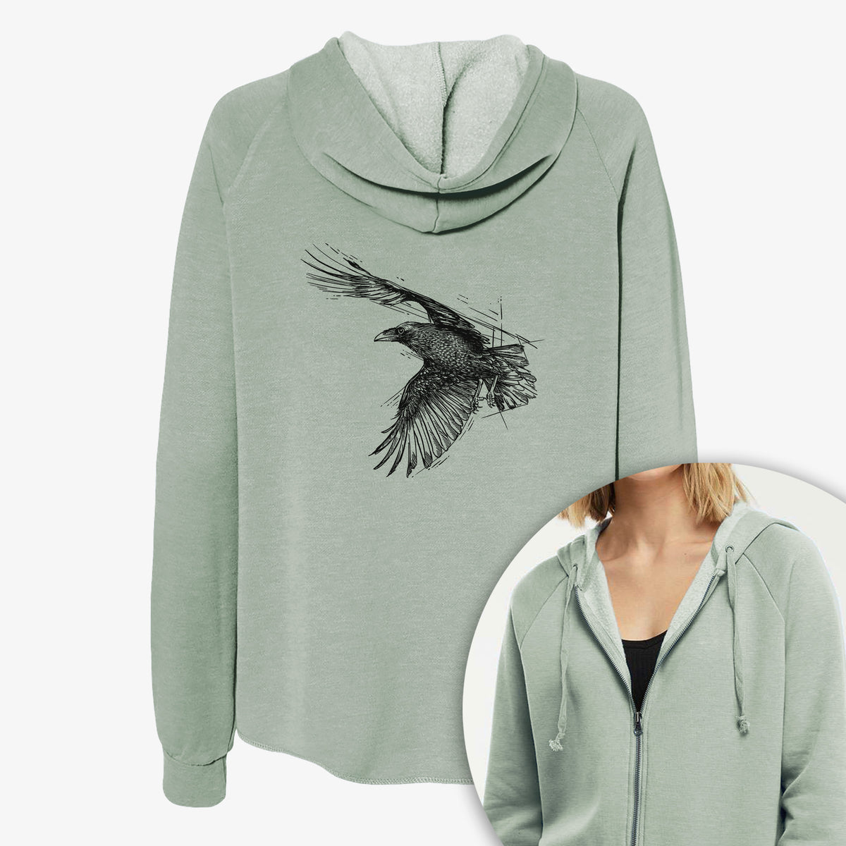 Women's Cali Wave zip-up sweatshirt printed with a black ink illustration of a raven in flight with its wings spread, with a close-up of the zipper.