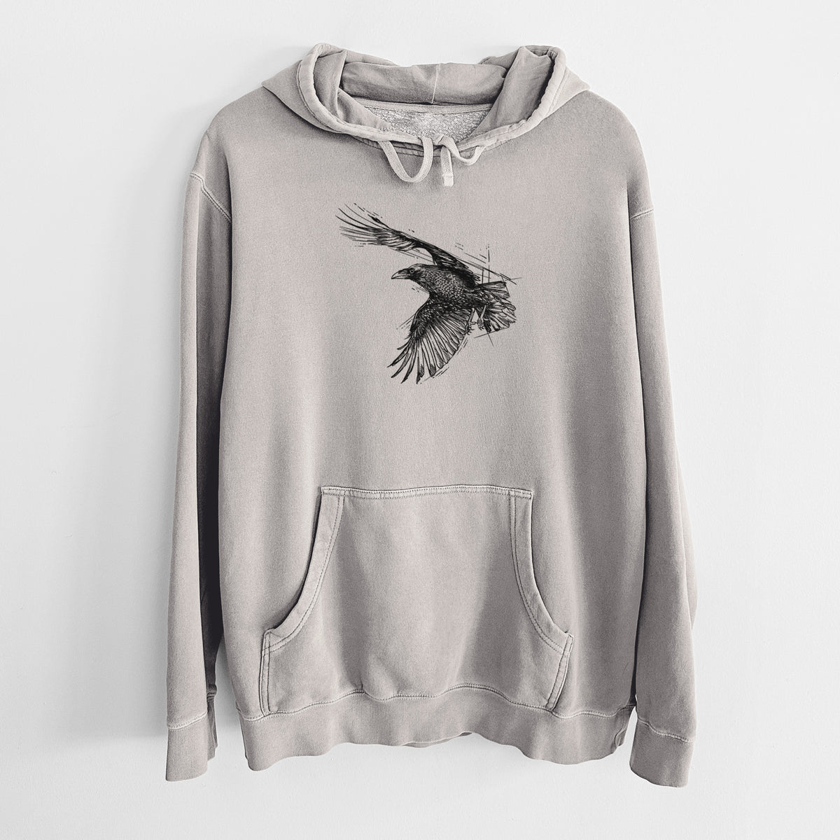 Cement grey pigment dyed hoodie laid flat, printed with a black ink illustration of a raven in flight with its wings spread.