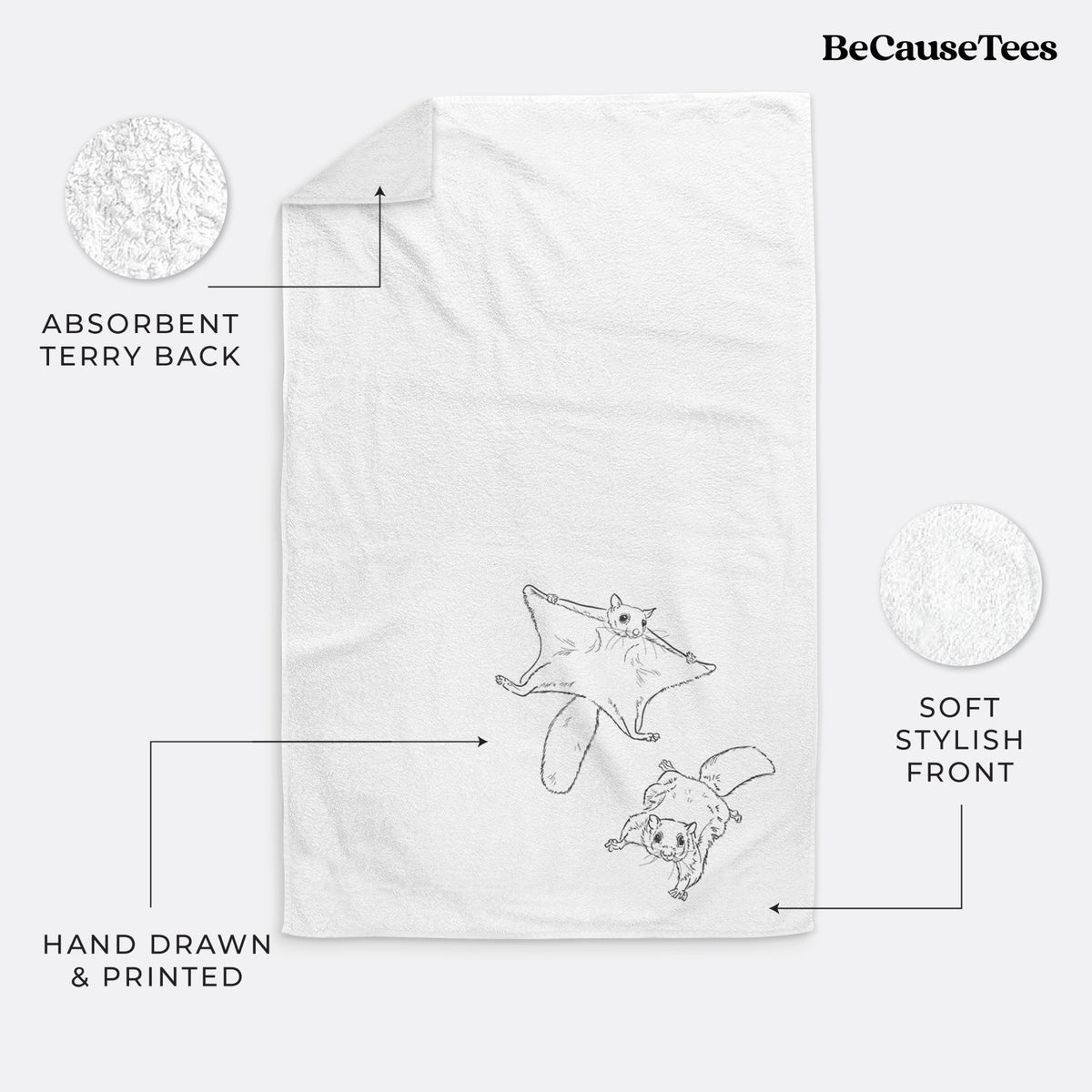 White hand towel printed with a black ink illustration of two flying squirrels gliding with their skin flaps spread.