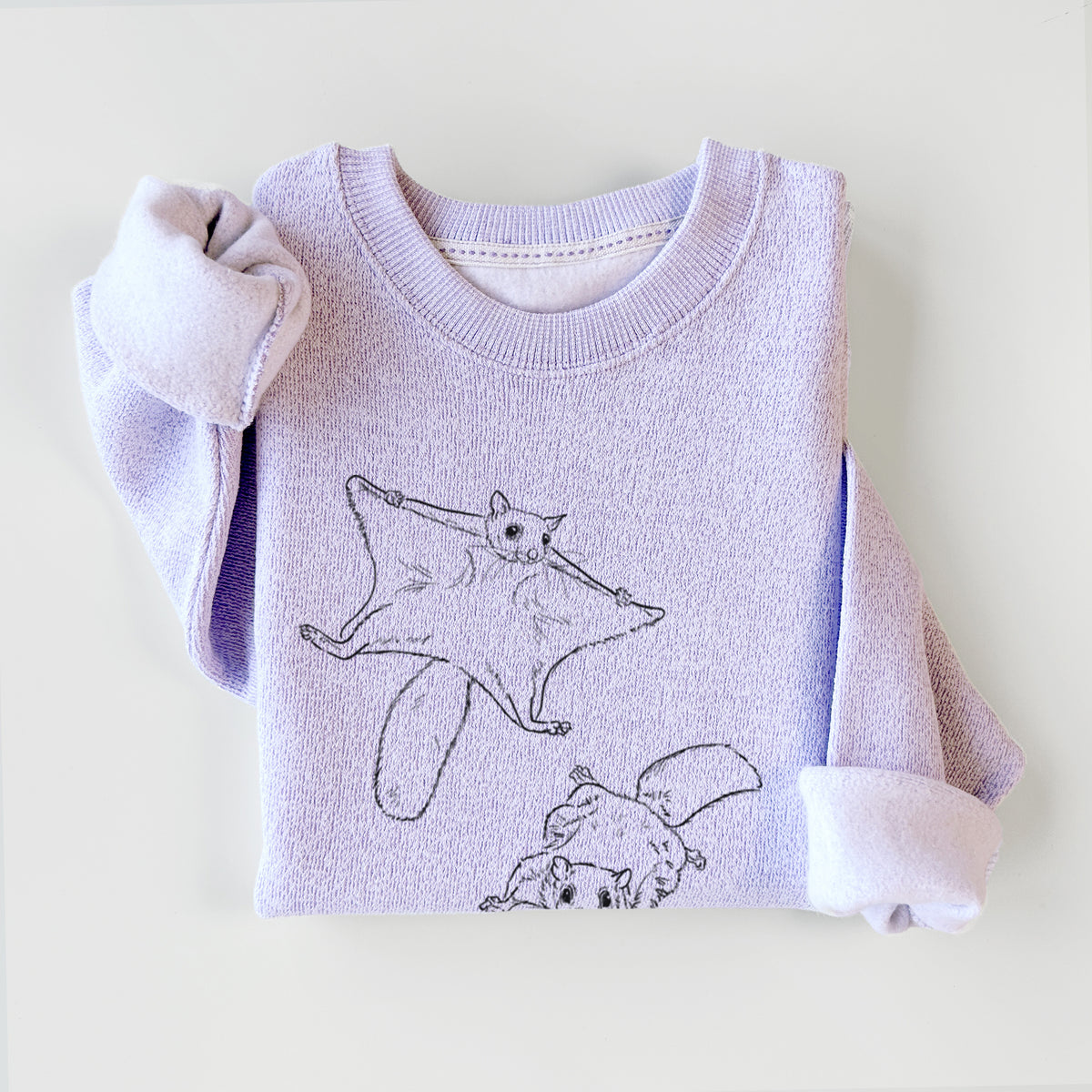 Ice purple knit sweatshirt printed with a black ink illustration of two flying squirrels gliding with their skin flaps spread, styled flat.