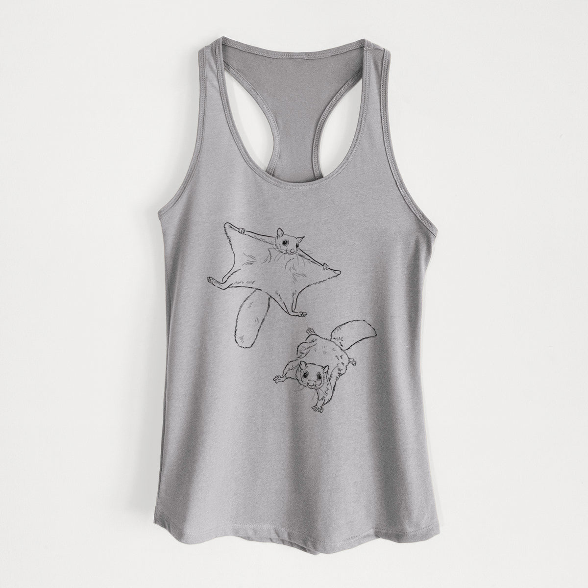 Heather grey women's racerback tank top laid flat, printed with a black ink illustration of two flying squirrels gliding with their skin flaps spread.