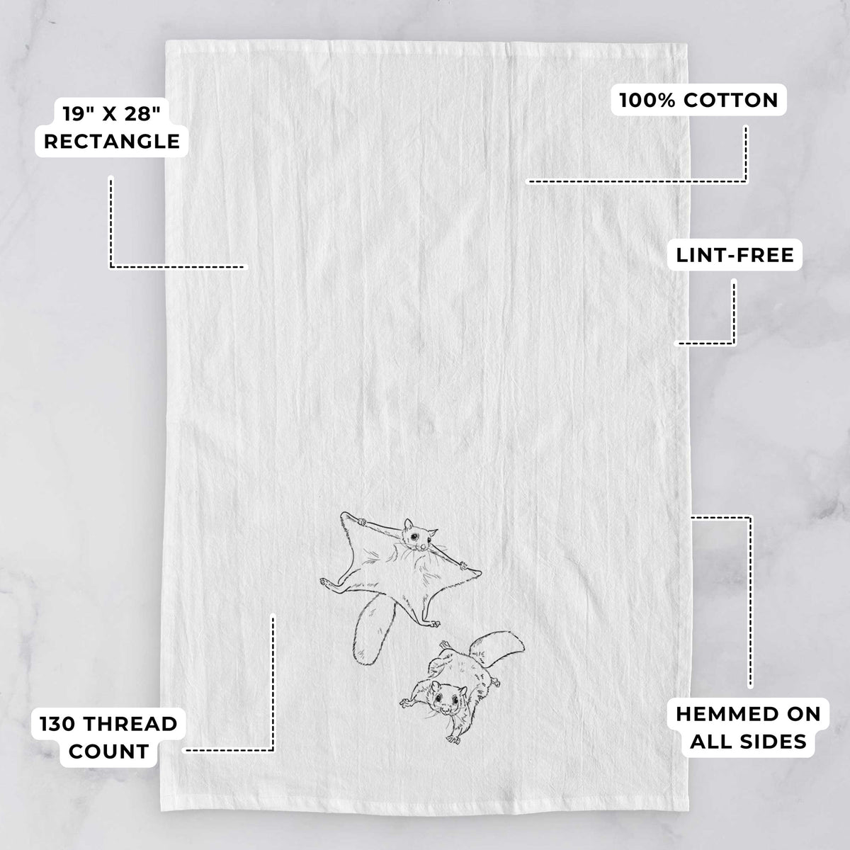 White tea towel printed with a black ink illustration of two flying squirrels gliding with their skin flaps spread, with feature labels: 19 by 28 inch rectangle, 100% cotton, lint-free, 130 thread count, hemmed on all sides.