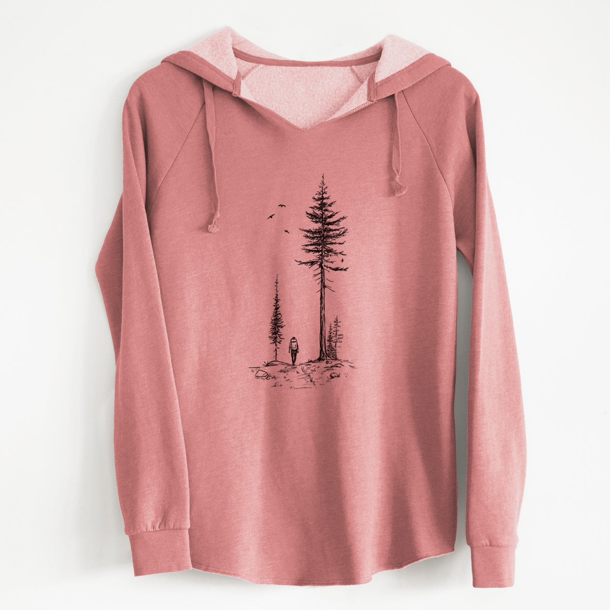 Dusty rose women's Cali Wave hooded sweatshirt laid flat, printed with a black ink illustration of a lone hiker walking between tall pine trees with birds overhead.