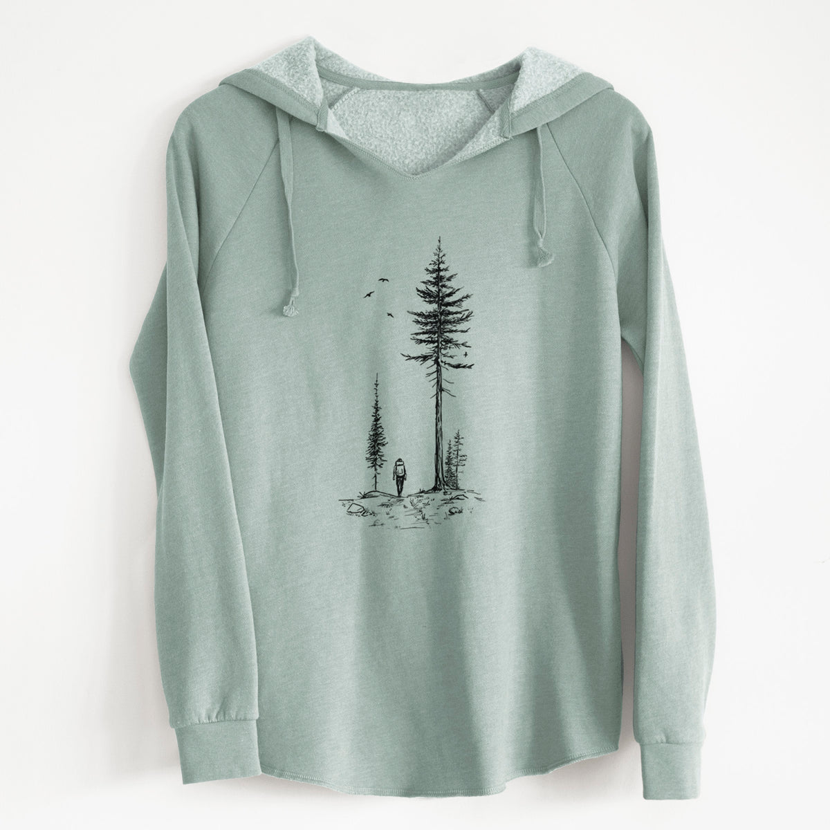 Sage green women's Cali Wave hooded sweatshirt laid flat, printed with a black ink illustration of a lone hiker walking between tall pine trees with birds overhead.