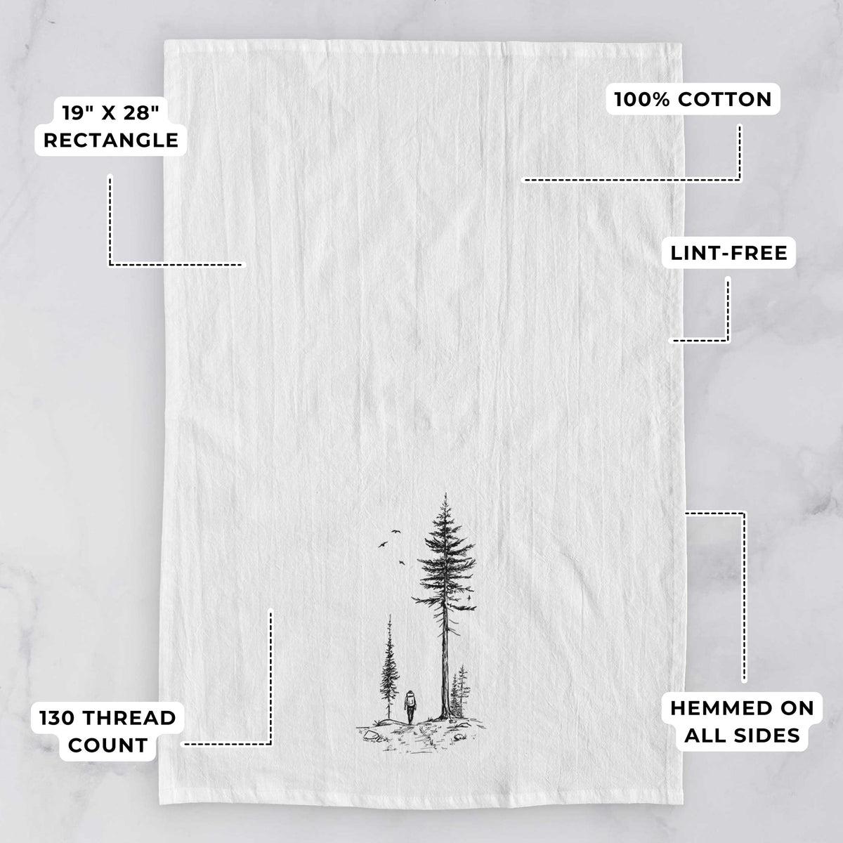 White tea towel printed with a black ink illustration of a lone hiker walking between tall pine trees with birds overhead, with feature labels: 19 by 28 inch rectangle, 100% cotton, lint-free, 130 thread count, hemmed on all sides.