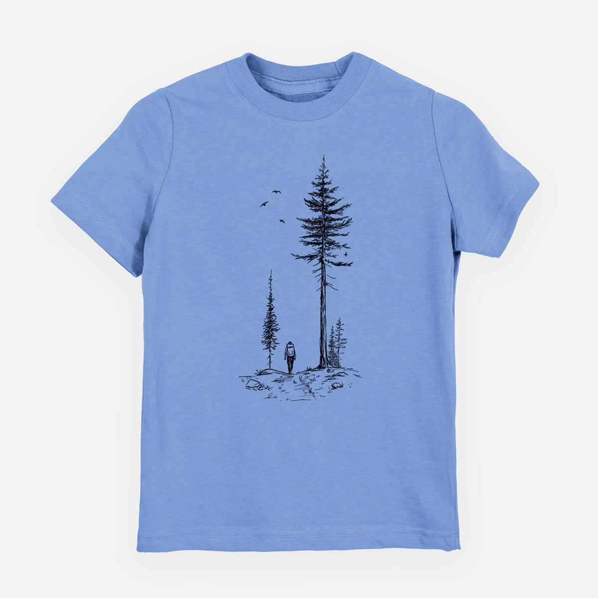 Carolina blue youth t-shirt laid flat, printed with a black ink illustration of a lone hiker walking between tall pine trees with birds overhead.