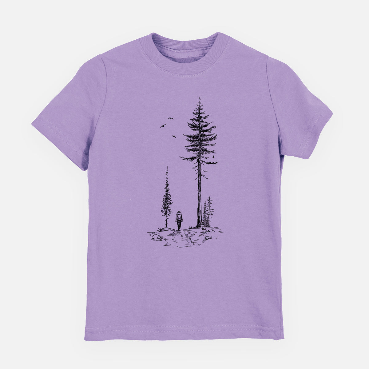Lavender youth t-shirt laid flat, printed with a black ink illustration of a lone hiker walking between tall pine trees with birds overhead.