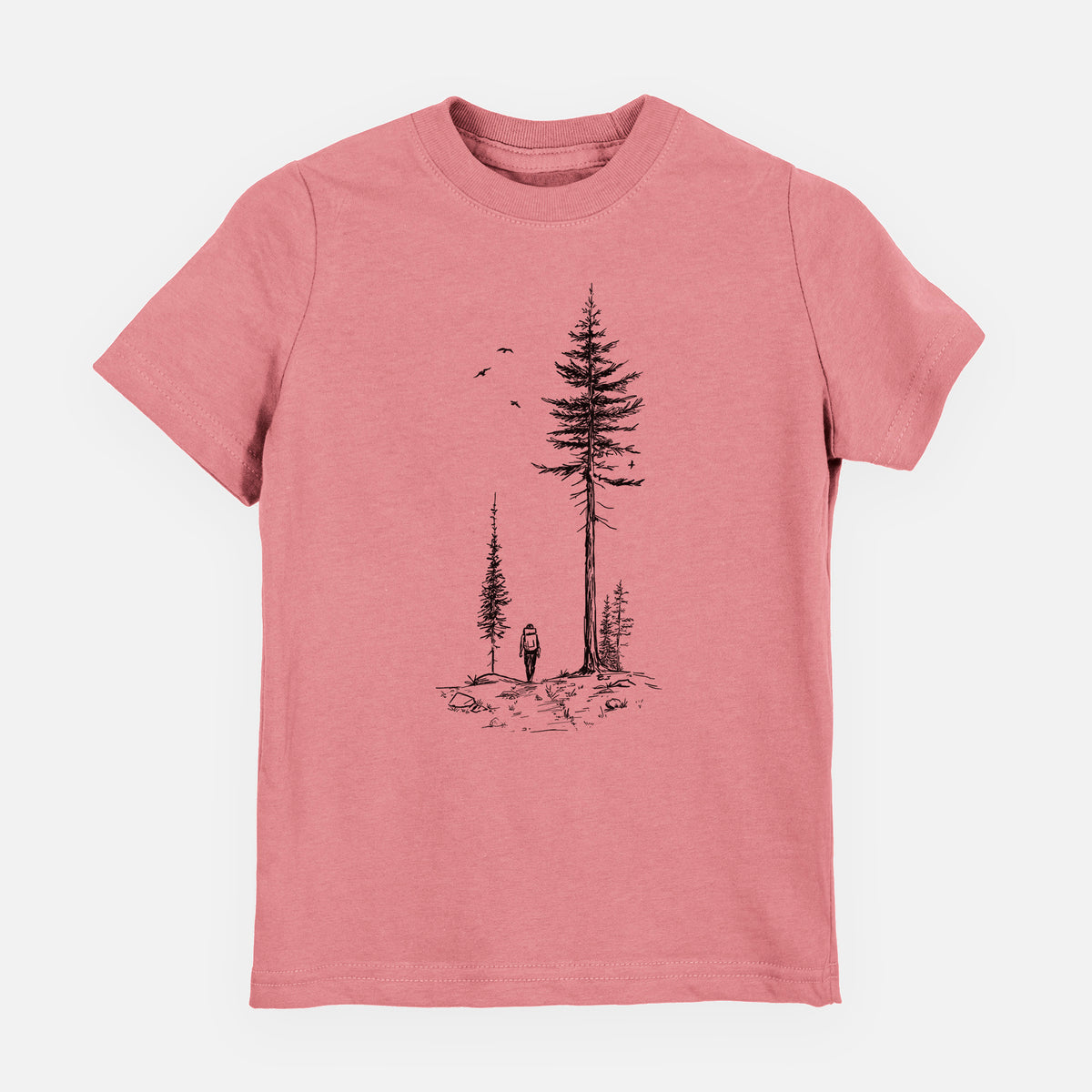 Mauve pink youth t-shirt laid flat, printed with a black ink illustration of a lone hiker walking between tall pine trees with birds overhead.