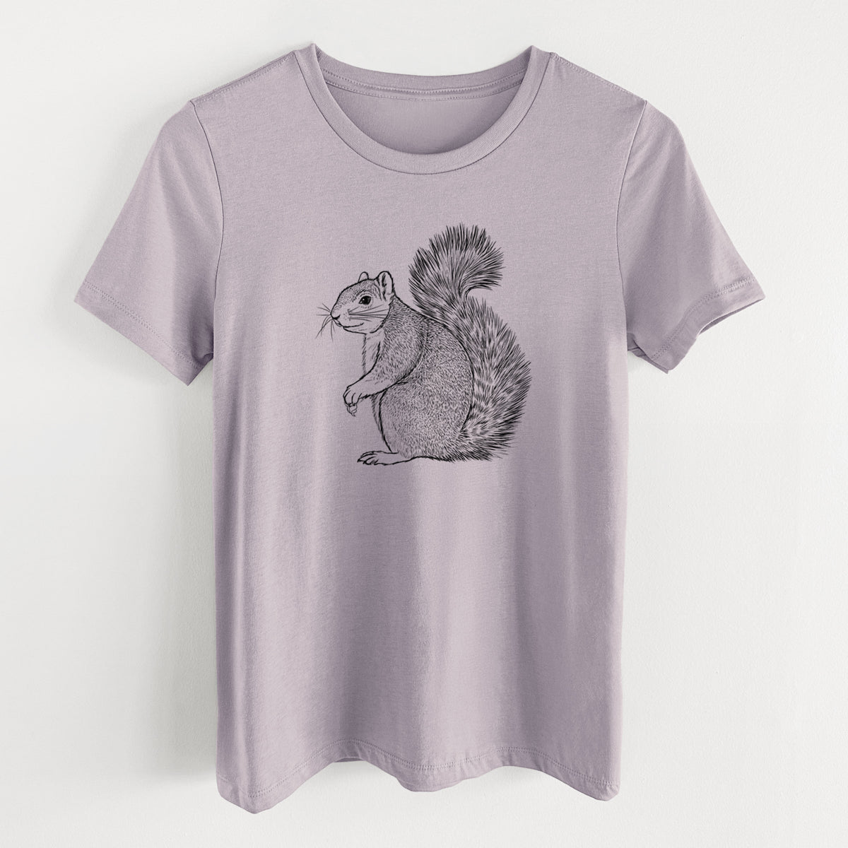Light violet women's relaxed fit cotton t-shirt laid flat, printed with a detailed black ink illustration of a fox squirrel sitting with a bushy tail.