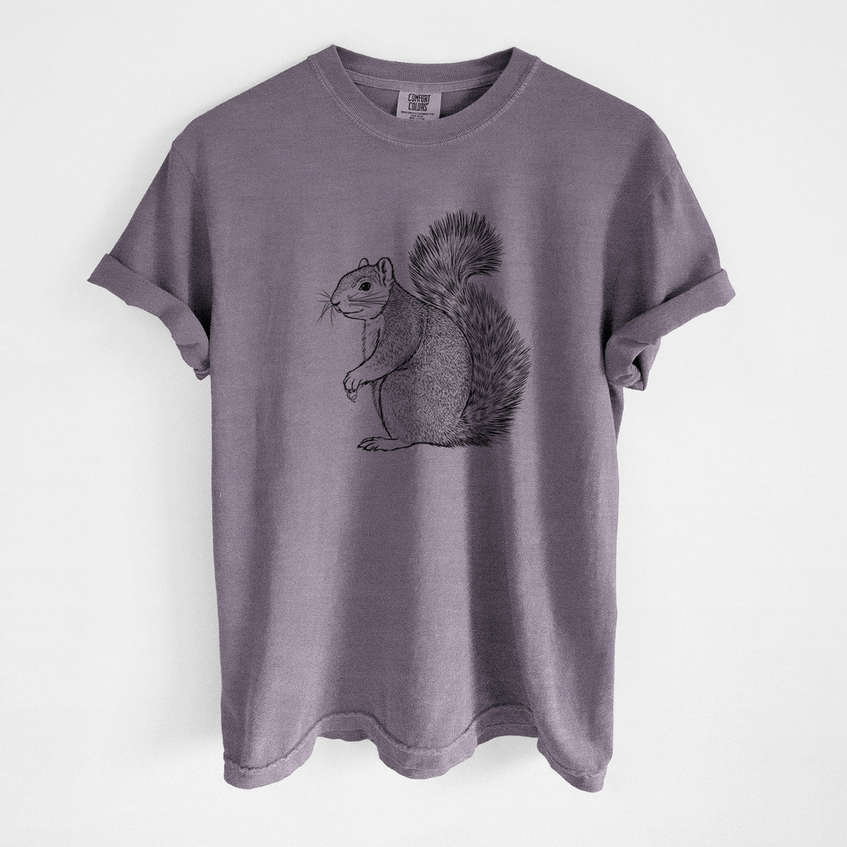 Wine red Comfort Colors t-shirt laid flat, printed with a detailed black ink illustration of a fox squirrel sitting with a bushy tail.