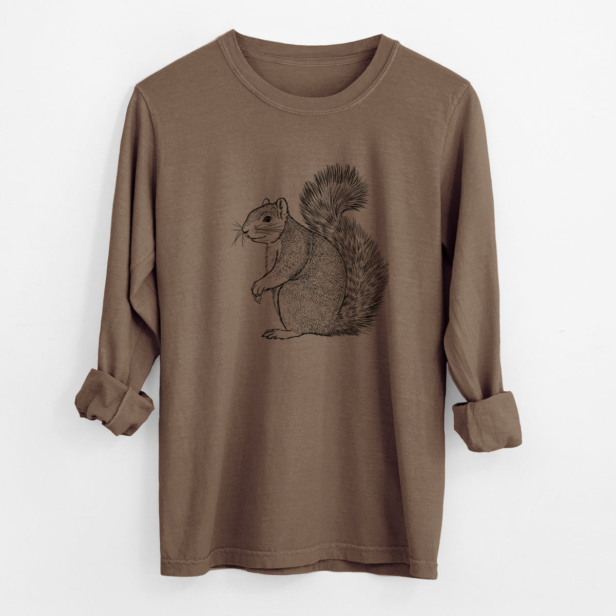 Espresso brown Comfort Colors long sleeve shirt laid flat with the cuffs rolled, printed with a detailed black ink illustration of a fox squirrel sitting with a bushy tail.