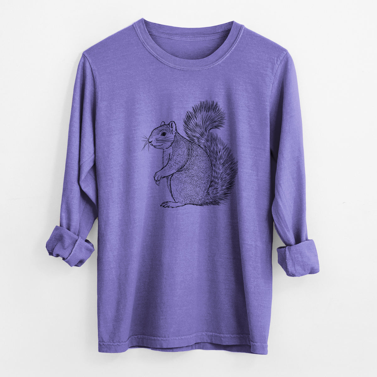Violet purple Comfort Colors long sleeve shirt laid flat with the cuffs rolled, printed with a detailed black ink illustration of a fox squirrel sitting with a bushy tail.