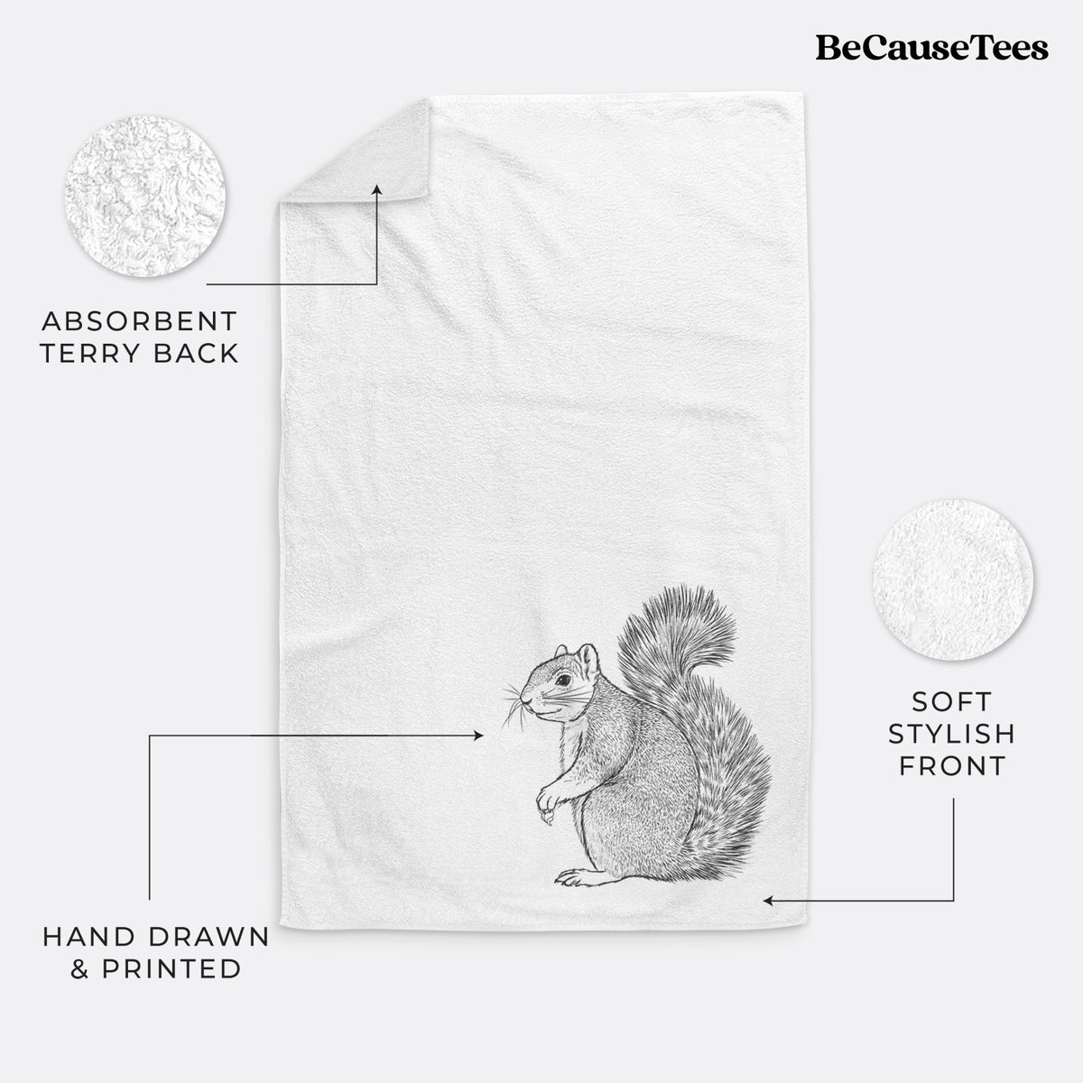 White hand towel printed with a detailed black ink illustration of a fox squirrel sitting with a bushy tail.
