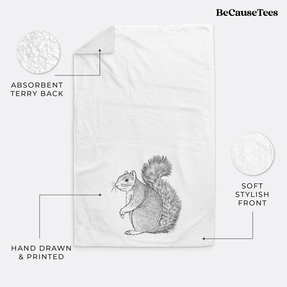 White hand towel printed with a detailed black ink illustration of a fox squirrel sitting with a bushy tail.
