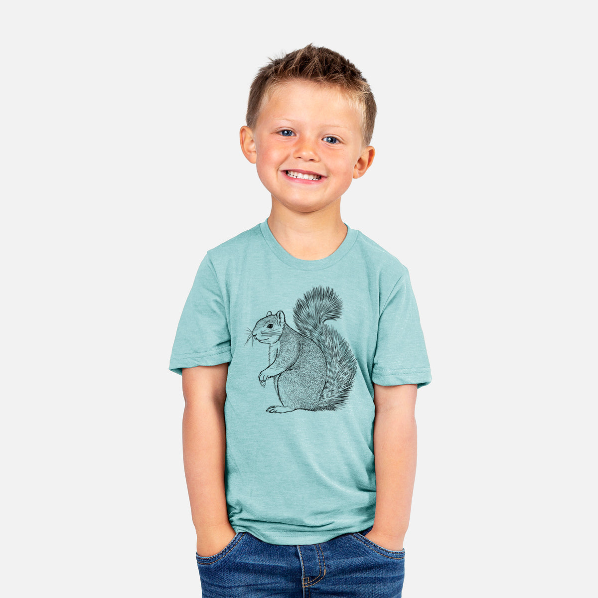 Smiling boy wearing a youth t-shirt printed with a detailed black ink illustration of a fox squirrel sitting with a bushy tail.