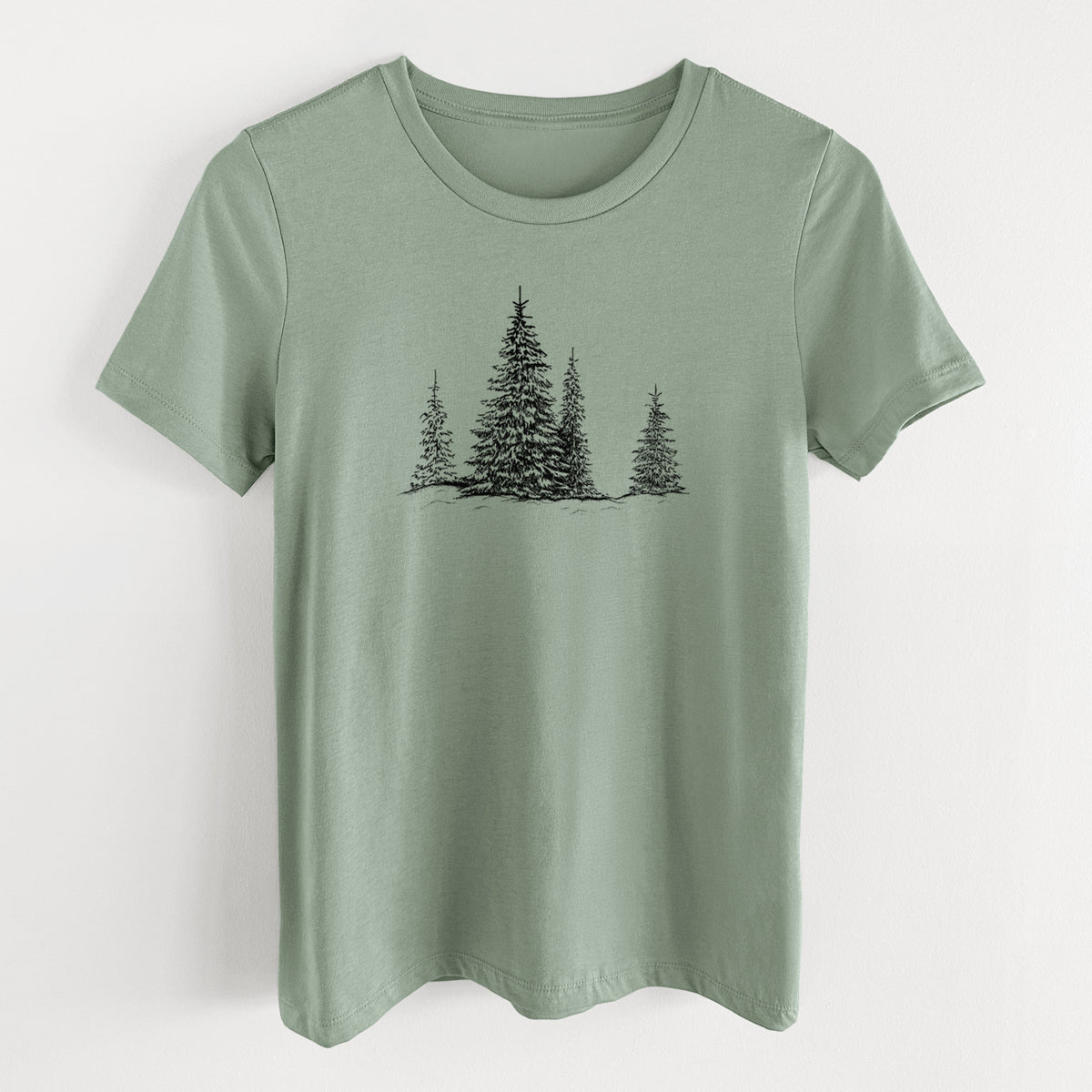 Sage green women's relaxed fit cotton t-shirt laid flat, printed with a black ink illustration of frost-covered evergreen trees.