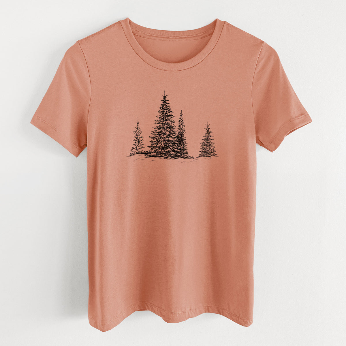 Terracotta orange women's relaxed fit cotton t-shirt laid flat, printed with a black ink illustration of frost-covered evergreen trees.