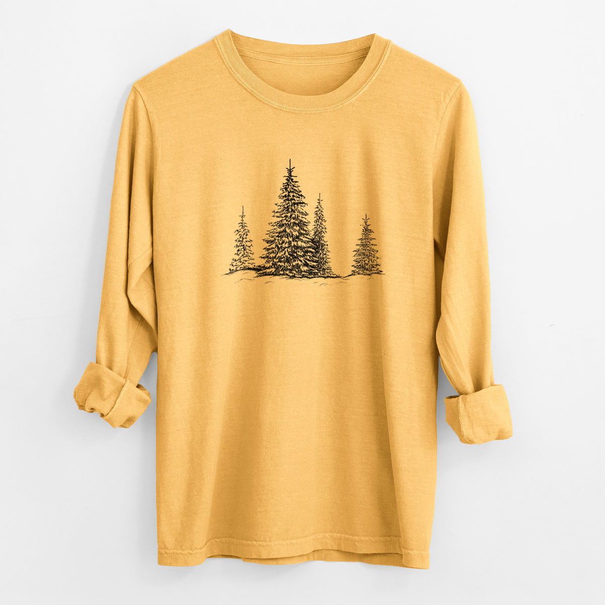 Golden wheat yellow Comfort Colors long sleeve shirt laid flat with the cuffs rolled, printed with a black ink illustration of frost-covered evergreen trees.