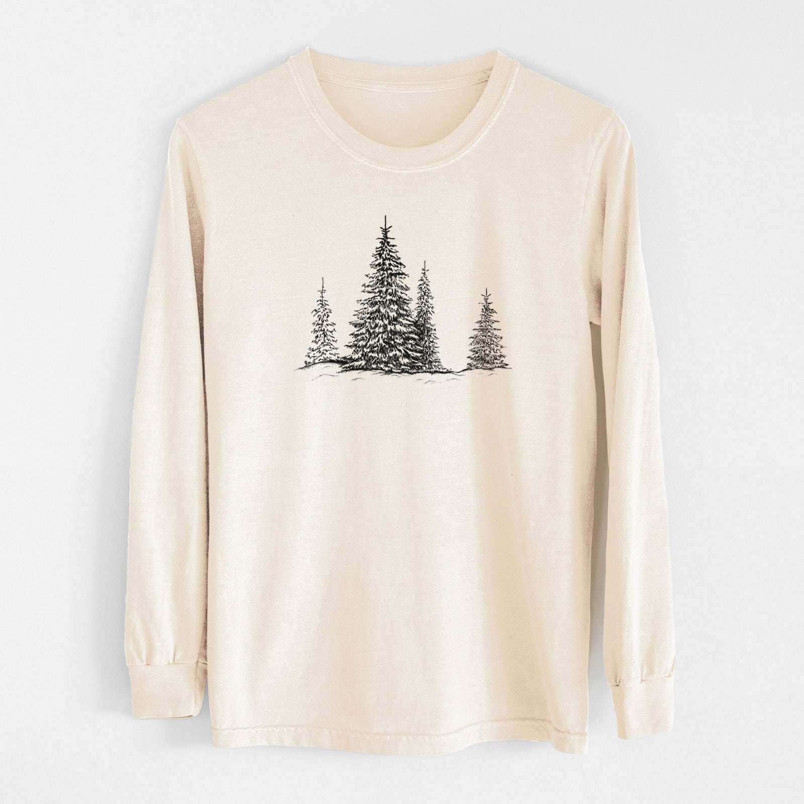 Ivory Comfort Colors long sleeve shirt laid flat, printed with a black ink illustration of frost-covered evergreen trees.