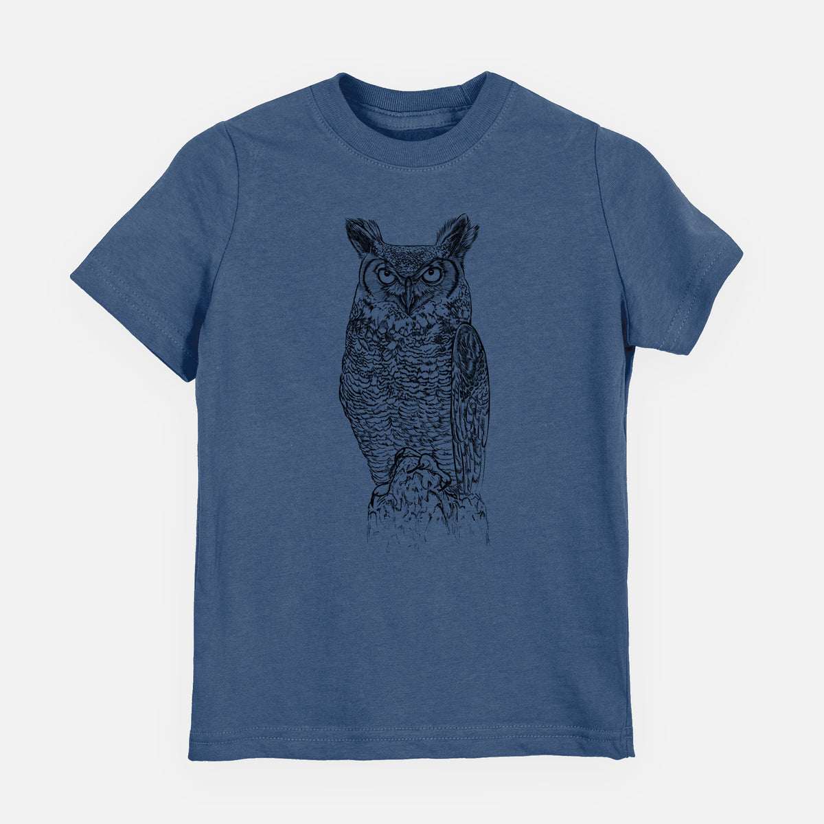 Indigo blue youth t-shirt laid flat, printed with a detailed black ink illustration of a great horned owl standing upright with its ear tufts raised.