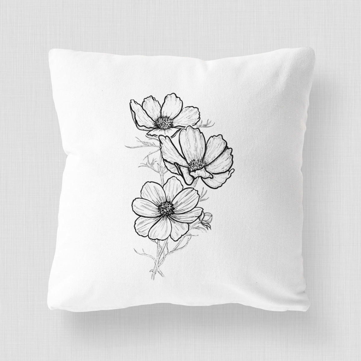 White pillow cover printed with a black ink line drawing of garden cosmos flowers on stems.