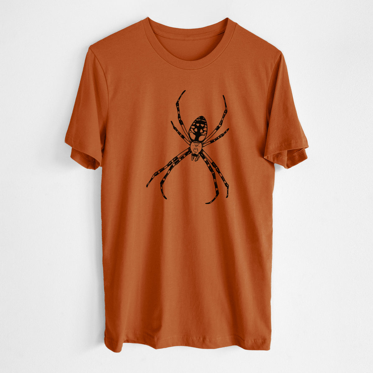 Autumn lightweight cotton t-shirt laid flat, printed with a detailed black ink illustration of a garden spider with long striped legs.