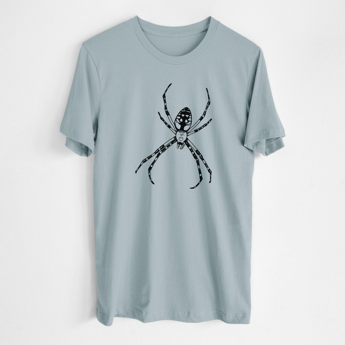 Vintage denim lightweight cotton t-shirt laid flat, printed with a detailed black ink illustration of a garden spider with long striped legs.