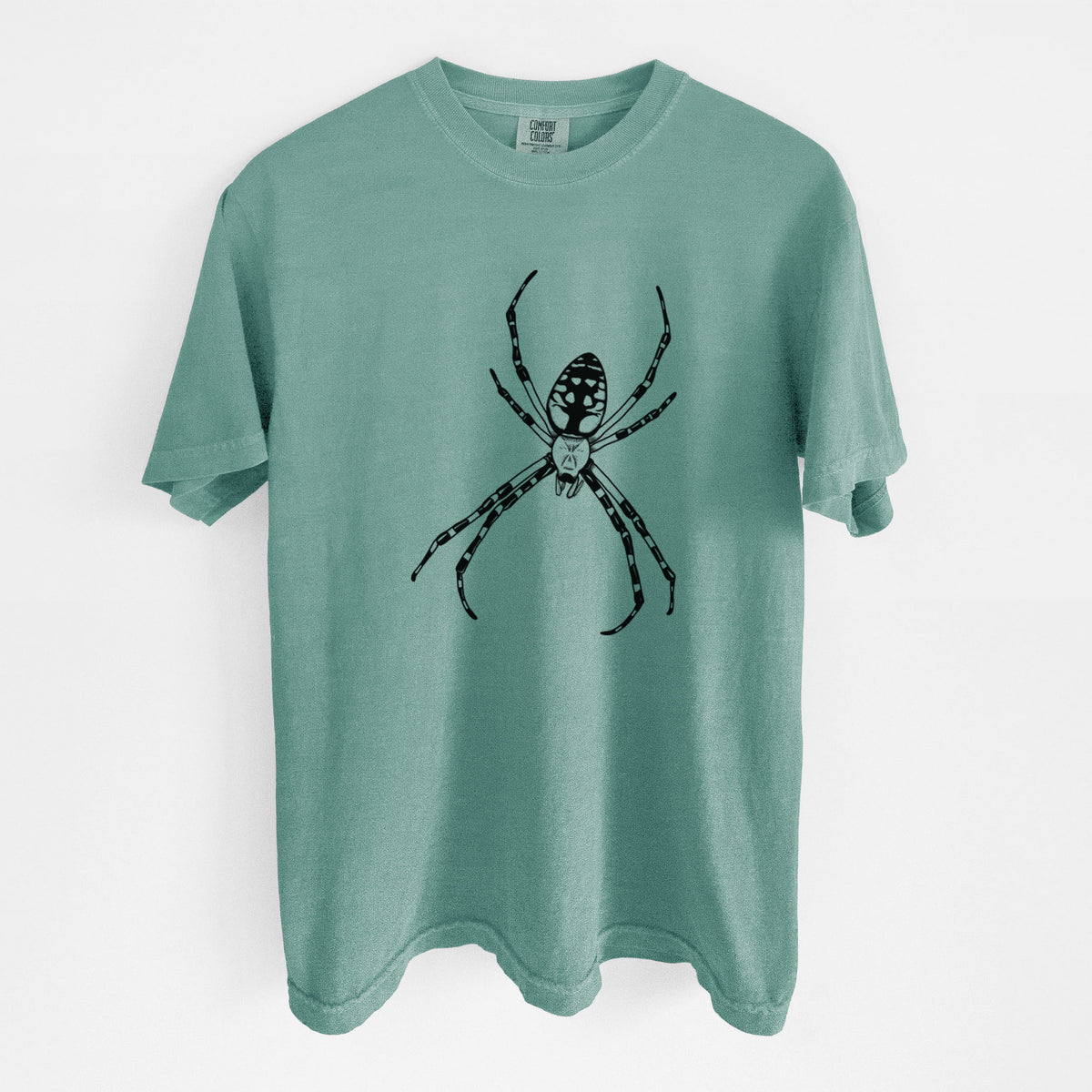 Reef green Comfort Colors t-shirt laid flat, printed with a detailed black ink illustration of a garden spider with long striped legs.
