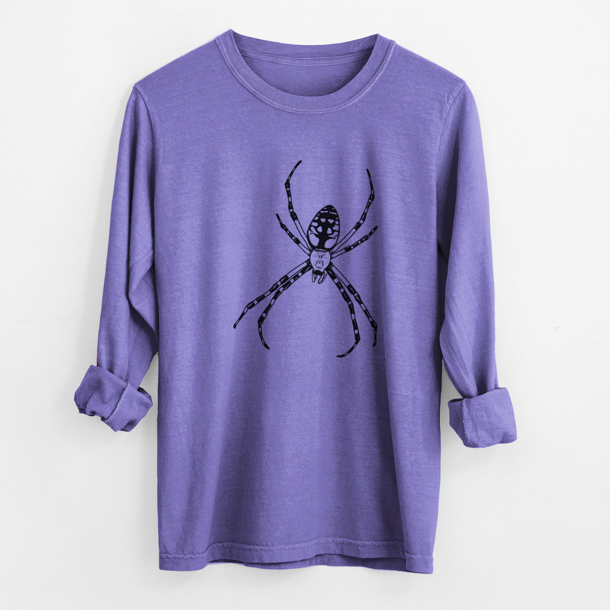 Violet purple Comfort Colors long sleeve shirt laid flat with the cuffs rolled, printed with a detailed black ink illustration of a garden spider with long striped legs.