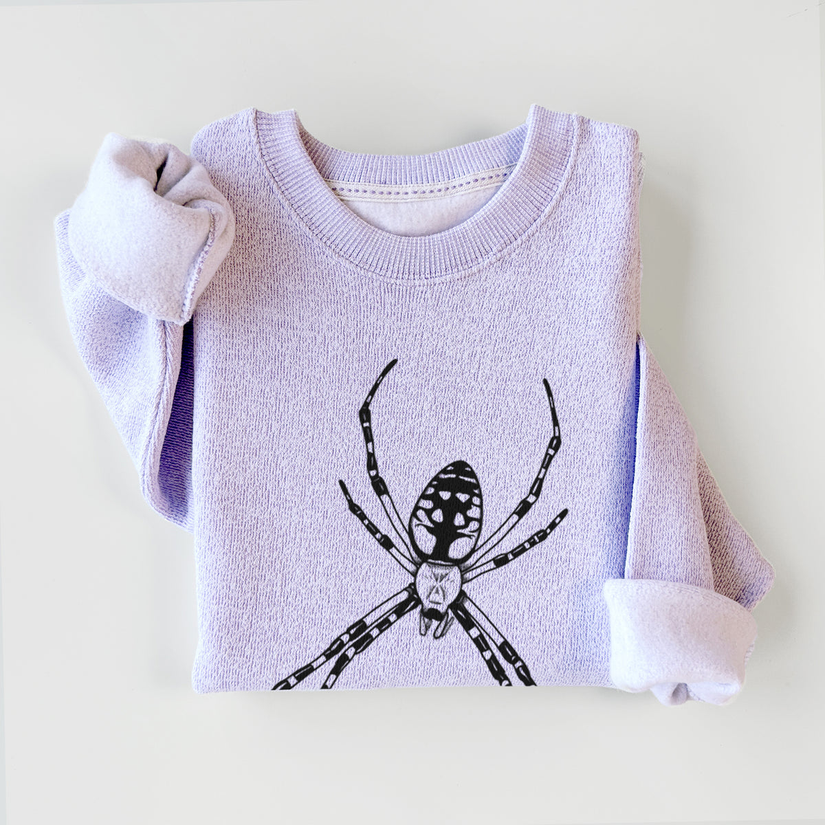 Ice purple knit sweatshirt printed with a detailed black ink illustration of a garden spider with long striped legs, styled flat.