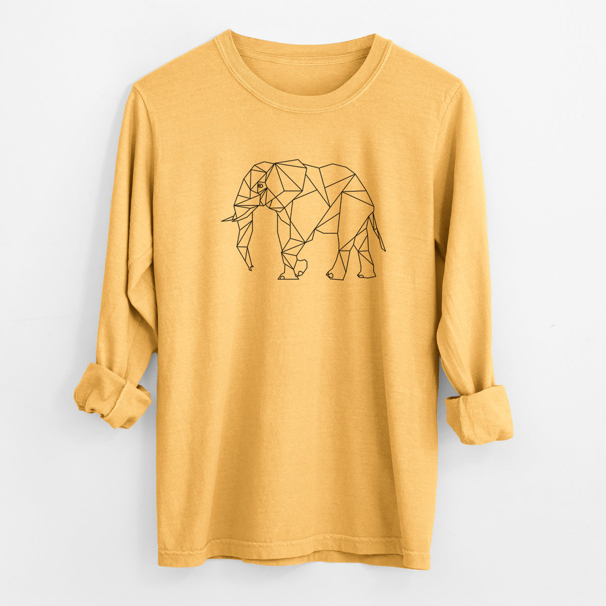 Golden wheat yellow Comfort Colors long sleeve shirt laid flat with the cuffs rolled, printed with a black geometric line art elephant.
