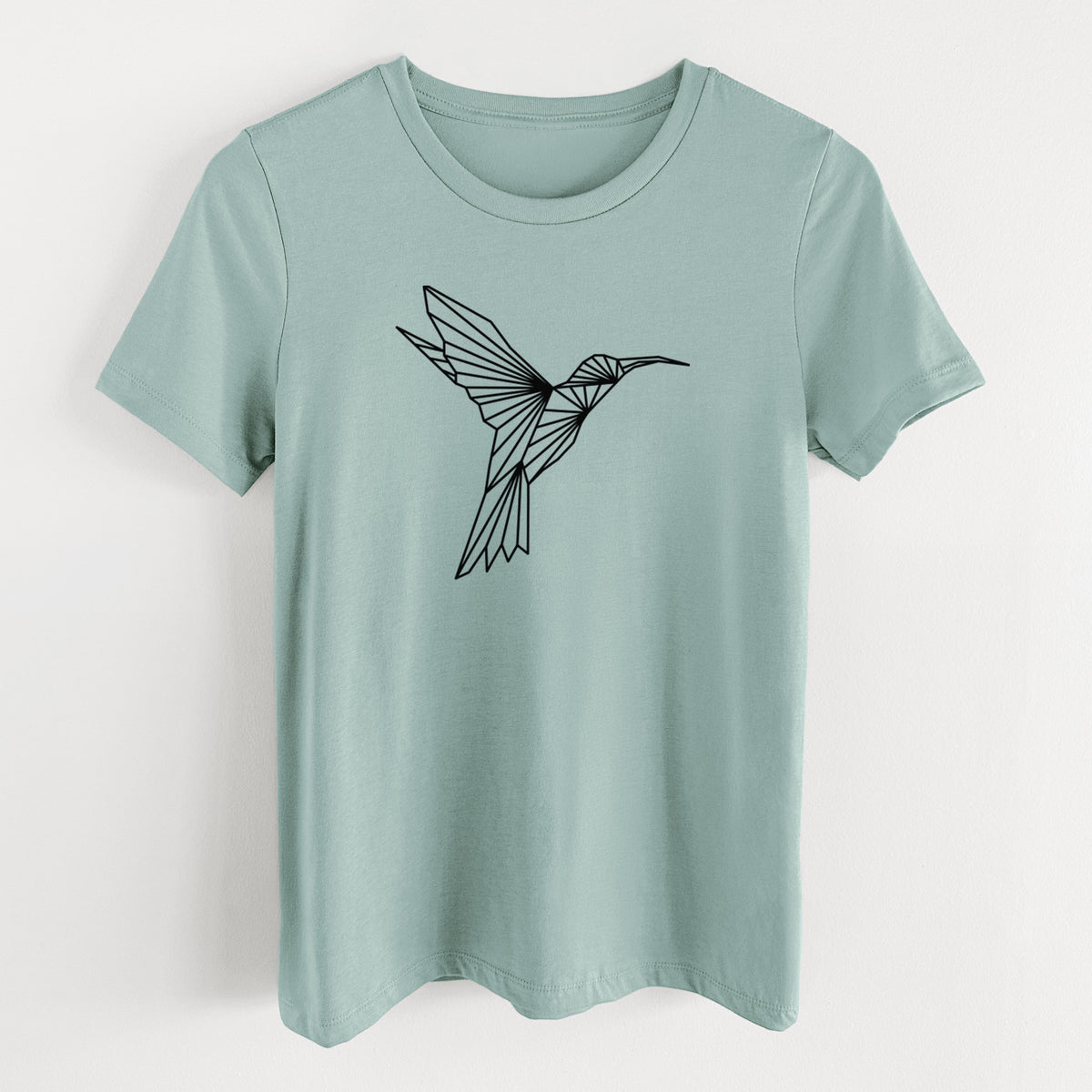 Dusty blue women's relaxed fit cotton t-shirt laid flat, printed with a black geometric line art hummingbird in flight.
