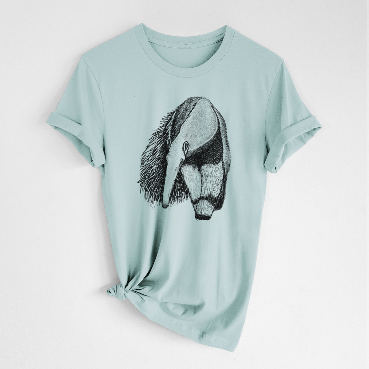 Dusty blue lightweight cotton t-shirt laid flat with the sleeves rolled, printed with a detailed black ink illustration of a giant anteater with its long snout and bushy tail.