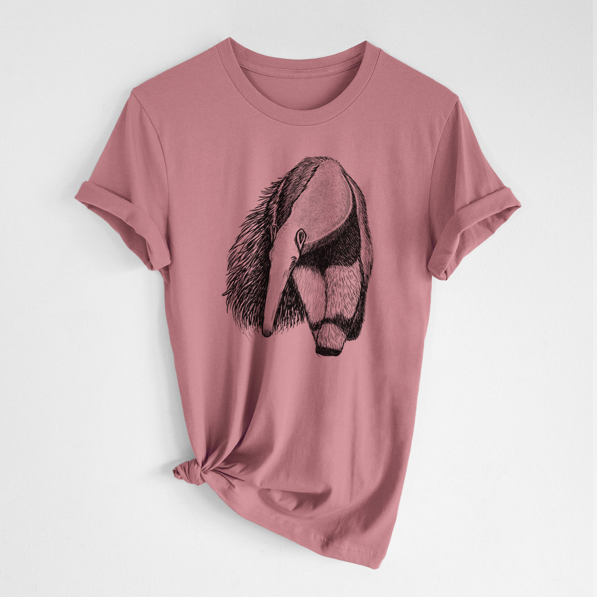 Mauve pink lightweight cotton t-shirt laid flat with the sleeves rolled, printed with a detailed black ink illustration of a giant anteater with its long snout and bushy tail.